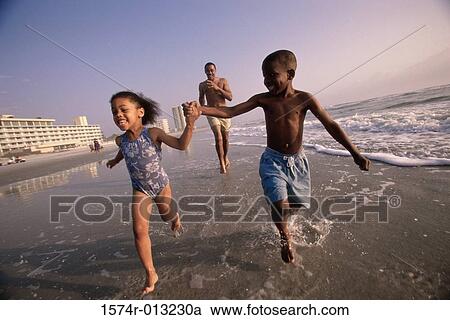Brother and sister running on the beach View Large Photo Image Stock Image - Brother and sister running on the beach. Fotosearch