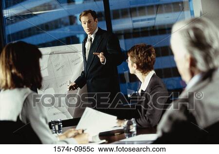Stock Image - Business executives in a meeting. Fotosearch