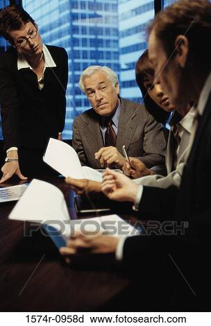 Business executives in a meeting View Large Photo Image Stock Image - Business executives in a meeting. Fotosearch