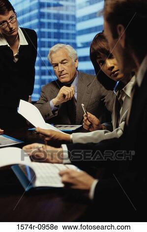 Business executives in a meeting View Large Photo Image Stock Image - Business executives in a meeting. Fotosearch