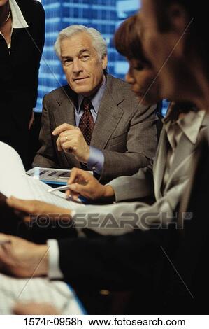 Business executives in a meeting View Large Photo Image Stock Image - Business executives in a meeting. Fotosearch