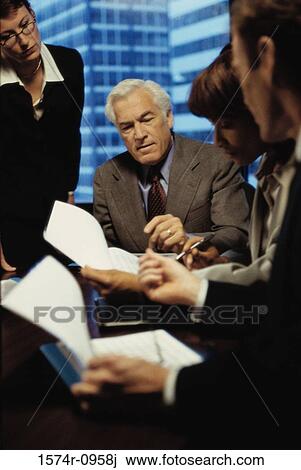 Business executives in a meeting View Large Photo Image Stock Image - Business executives in a meeting. Fotosearch