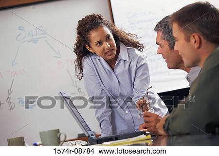 Picture - Business executives in an office. Fotosearch