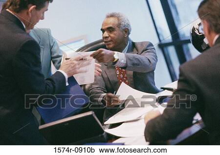 Stock Image - Business executives in an office. Fotosearch