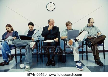 Business executives sitting in a row operating laptops View Large Photo Image Stock Image - Business executives sitting in a row operating laptops. Fotosearch
