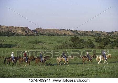 Cattle ranchers on horseback View Large Photo Image Stock Image - Cattle ranchers on horseback. Fotosearch