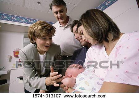 Close-up of a baby boy with his parents and grandparents in a hospital View Large Photo Image Stock Photo - Close-up of a baby boy with his parents and grandparents in a hospital. Fotosearch