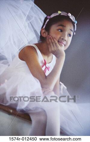 Close-up of a ballerina sitting with her hand on her chin View Large Photo Image Stock Image - Close-up of a ballerina sitting with her hand on her chin. Fotosearch