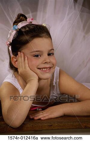 Close-up of a ballerina smiling with her hand on her chin View Large Photo Image Stock Image - Close-up of a ballerina smiling with her hand on her chin. Fotosearch