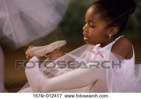 Stock Photo - Close-up of a ballerina wearing ballet slippers. Fotosearch