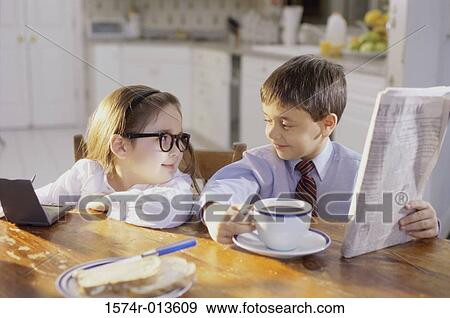 Stock Photo - Close-up of a boy and girl at a breakfast table. Fotosearch