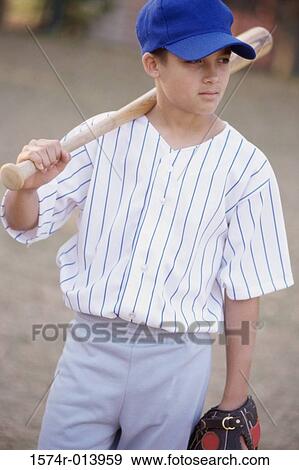 Stock Photo - Close-up of a boy holding a baseball bat. Fotosearch
