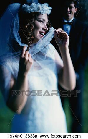 Stock Image - Close-up of a bride smiling. Fotosearch