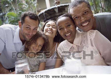 Close-up of a family smiling View Large Photo Image Stock Image - Close-up of a family smiling. Fotosearch