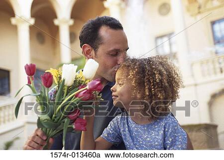 Close-up of a father kissing his daughter View Large Photo Image Stock Image - Close-up of a father kissing his daughter. Fotosearch