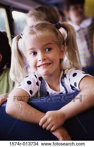 Close-up of a girl sitting in a school bus View Large Photo Image Picture - Close-up of a girl sitting in a school bus. Fotosearch