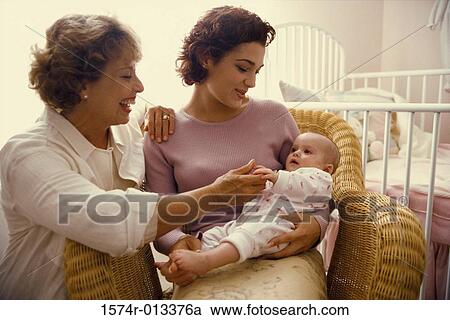 Close-up of a grandmother smiling with her daughter and granddaughter View Large Photo Image Stock Image - Close-up of a grandmother smiling with her daughter and granddaughter. Fotosearch