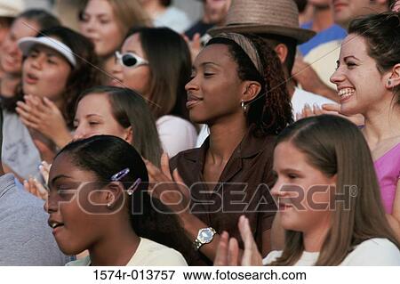 Close-up of a group of spectators clapping View Large Photo Image Stock Photo - Close-up of a group of spectators clapping. Fotosearch