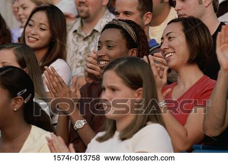 Close-up of a group of spectators clapping View Large Photo Image Stock Photo - Close-up of a group of spectators clapping. Fotosearch