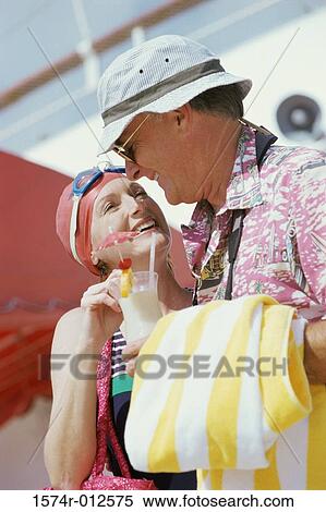 Stock Photography - Close-up of a mature couple looking at each other and smiling. Fotosearch