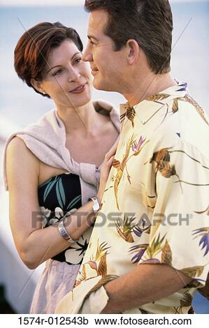 Stock Image - Close-up of a mature couple standing together. Fotosearch