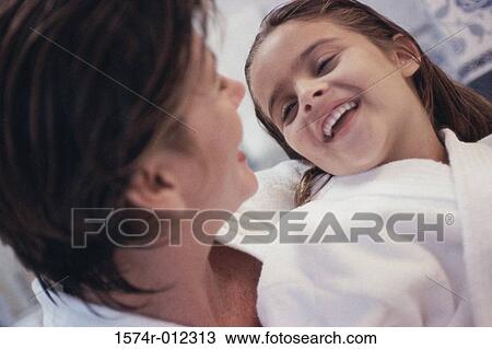 Close-up of a mother and daughter smiling View Large Photo Image Stock Image - Close-up of a mother and daughter smiling. Fotosearch