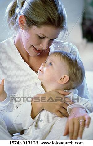 Close-up of a mother and son looking at each other View Large Photo Image Stock Photo - Close-up of a mother and son looking at each other. Fotosearch