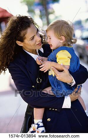 Picture - Close-up of a mother consoling her baby. Fotosearch