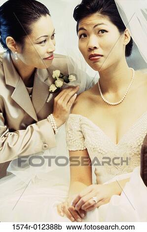 Close-up of a mother consoling her daughter View Large Photo Image Stock Image - Close-up of a mother consoling her daughter. Fotosearch