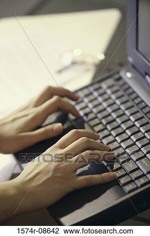 Close-up of a person's hands on a laptop View Large Photo Image Stock Image - Close-up of a person's hands on a laptop. Fotosearch