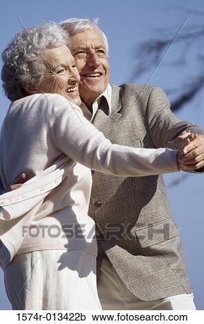 Stock Image - Close-up of a senior couple dancing. Fotosearch
