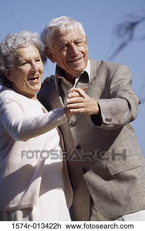 Stock Image - Close-up of a senior couple dancing. Fotosearch