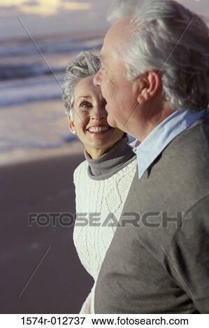 Close-up of a senior couple standing on the beach View Large Photo Image Stock Photo - Close-up of a senior couple standing on the beach. Fotosearch