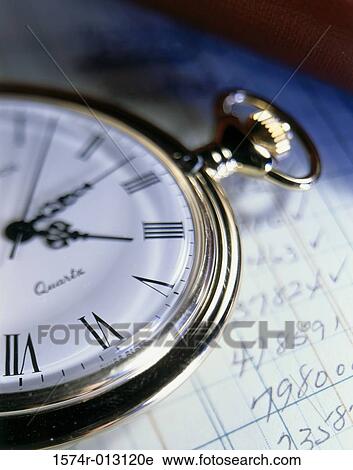 Close-up of a stopwatch on sheets of paper View Large Photo Image Stock Image - Close-up of a stopwatch on sheets of paper. Fotosearch