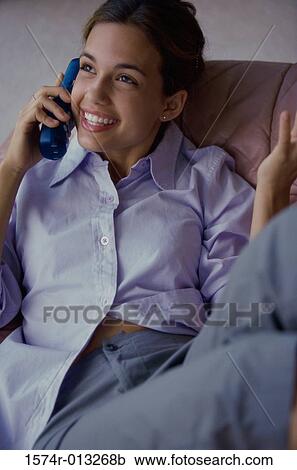 Close-up of a teenage girl talking on a phone View Large Photo Image Stock Image - Close-up of a teenage girl talking on a phone. Fotosearch