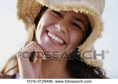Close-up of a teenage girl wearing a straw hat View Large Photo Image Stock Image - Close-up of a teenage girl wearing a straw hat. Fotosearch
