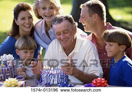 Close-up of a three generation family celebrating a birthday View Large Photo Image Stock Photograph - Close-up of a three generation family celebrating a birthday. Fotosearch