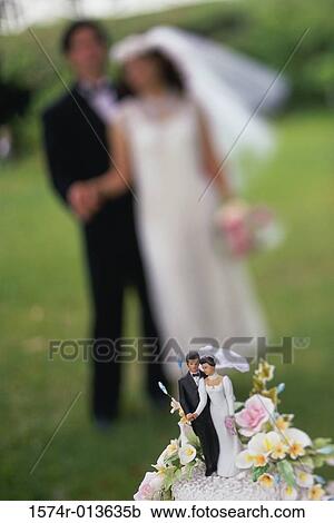 Close-up of a wedding cake figurine View Large Photo Image Stock Image - Close-up of a wedding cake figurine. Fotosearch