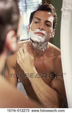 Close-up of a young man shaving in the bathroom View Large Photo Image Stock Image - Close-up of a young man shaving in the bathroom. Fotosearch