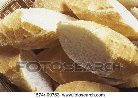 Close-up of bread in a basket View Large Photo Image Stock Image - Close-up of bread in a basket. Fotosearch