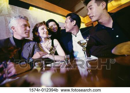 Close-up of five people in a bar View Large Photo Image Stock Image - Close-up of five people in a bar. Fotosearch