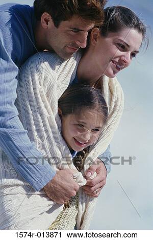 Close-up of parents and their daughter smiling View Large Photo Image Stock Image - Close-up of parents and their daughter smiling. Fotosearch