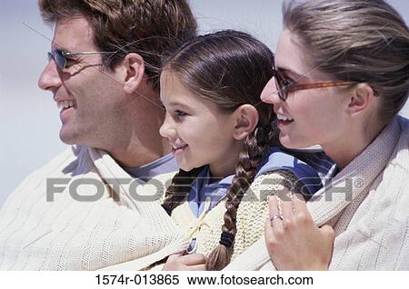 Close-up of parents and their daughter smiling View Large Photo Image Stock Photography - Close-up of parents and their daughter smiling. Fotosearch