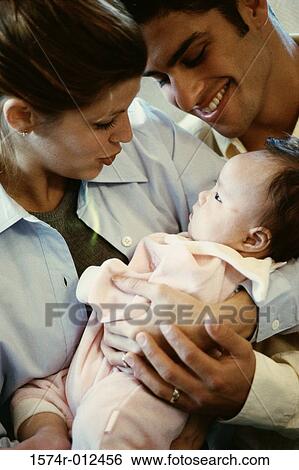 Stock Photograph - Close-up of parents looking at their son. Fotosearch