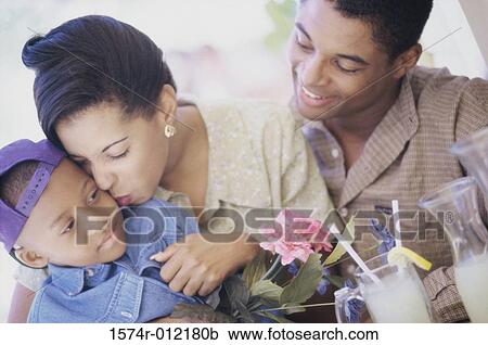 Close-up of parents with their son View Large Photo Image Stock Image - Close-up of parents with their son. Fotosearch