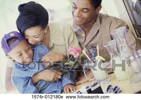Close-up of parents with their son View Large Photo Image Stock Image - Close-up of parents with their son. Fotosearch