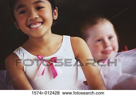 Stock Photo - Close-up of two ballet dancers smiling. Fotosearch