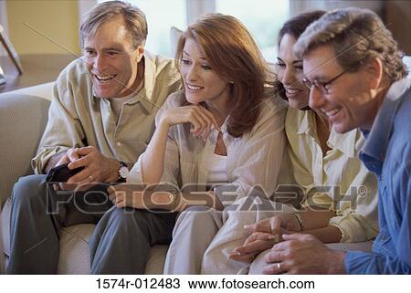 Close-up of two couples smiling View Large Photo Image Stock Image - Close-up of two couples smiling. Fotosearch