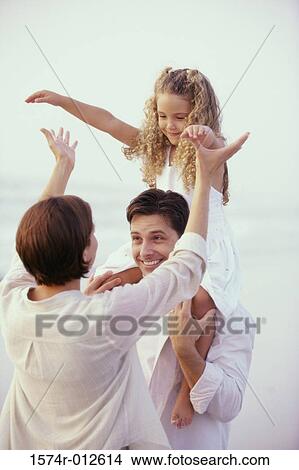 Daughter sitting on her father's shoulder View Large Photo Image Picture - Daughter sitting on her father's shoulder. Fotosearch