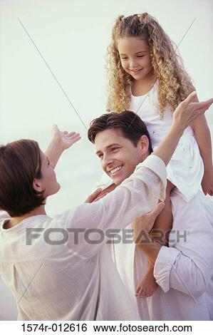 Daughter sitting on her father's shoulder View Large Photo Image Stock Photograph - Daughter sitting on her father's shoulder. Fotosearch